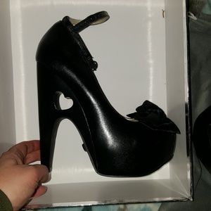 TUK 9 black super high heart cut out platforms bow